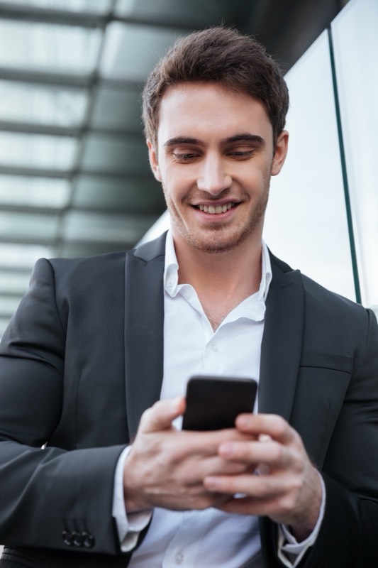 Ops manager checking updates on a phone